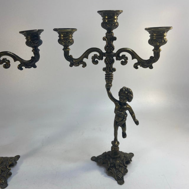 Vintage Pair Cherub Three Armed Candle Holder Cast Metal Italy Chateau Style This vintage pair of cherub three-armed...