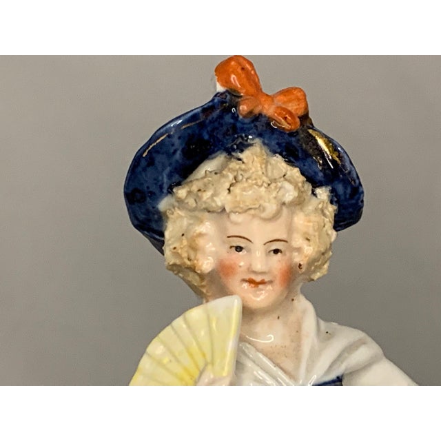 Antique German Bisque Figural Spill Vase for your consideration. The figural spill vase measures approx. 6 1/2 inches...