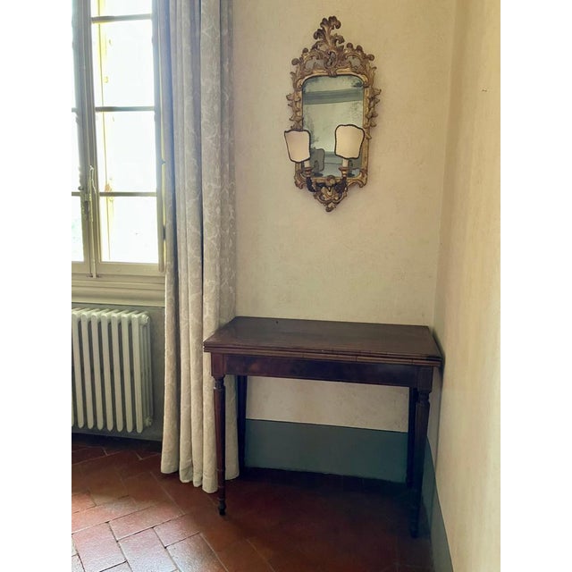 An exquisite and highly versatile pair of Italian late 18th-century Neoclassical folding game tables or consoles,...