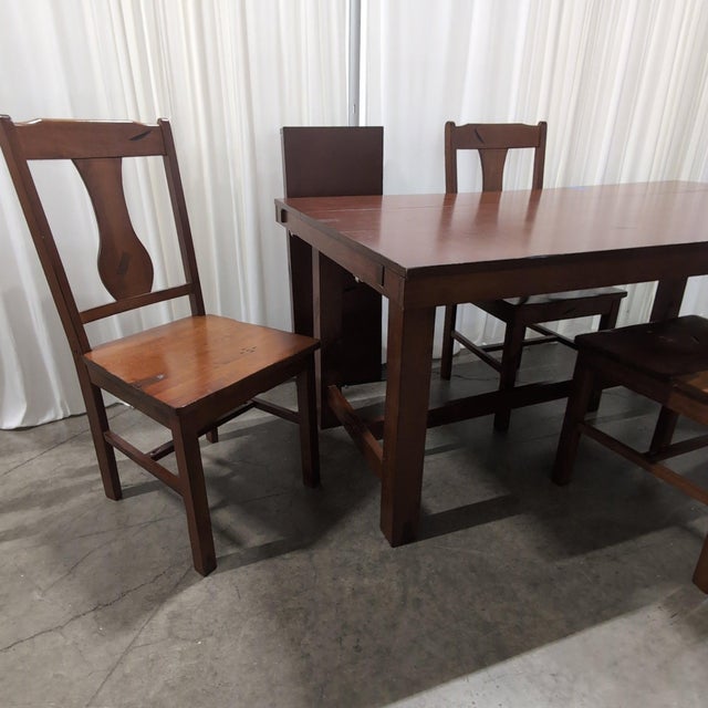 Walker Edison Huntsman five-piece dining set in a distressed dark oak finish: the extendable trestle dining table with...