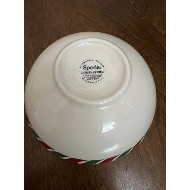 Elevate your festive table setting with the Spode Christmas Tree Candy Cane Bowl, an exquisite 6" stoneware dish that...