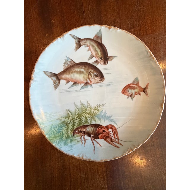 This pristine set of Rosenthal “Fish Course” plates is both beautiful and whimsical. The fish faces are infused with...