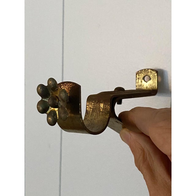 Little flower Brass with beautiful patina Screws to wall and are adjustable in several places Can accommodate a rod up to...