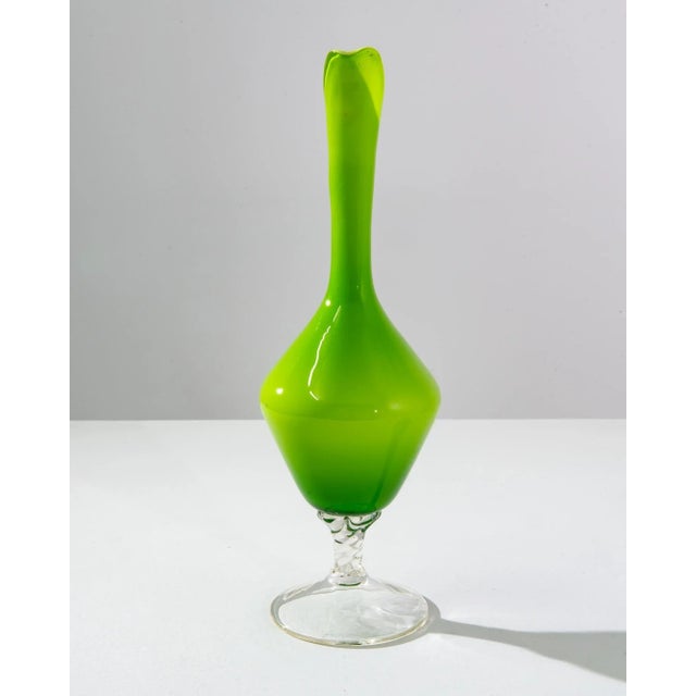 This vibrant 1960s Italian green glass jug is a splendid example of the bold and expressive design ethos of the era. Its...