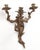 Pair of early 20th century Louis XV style wall sconces. Elaborate foliate designs intertwine to support three candle...