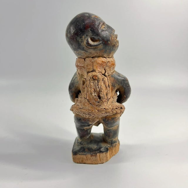 The Kongo Nkisi Nkondi Power Fetish Figure from Congo is a striking, handcrafted spiritual object used in rituals to...