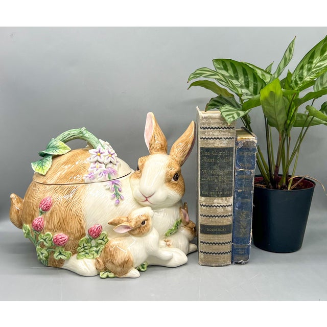 Captivating early 21st-century Fitz & Floyd Botanical Bunny cookie jar featuring a mother rabbit surrounded by her...