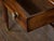 An English mahogany writing table from the 19th century, with green leather top, gilt accents, carved reeded legs, two...