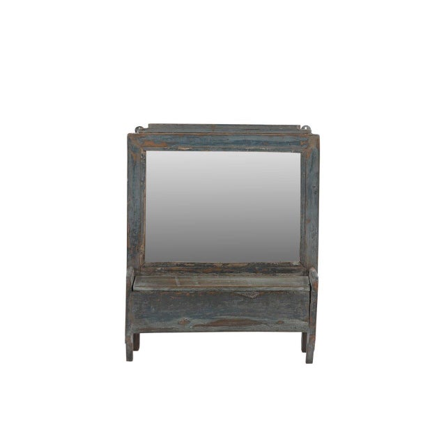This Vintage Indian Hanging Wall Mirror is a charming rustic piece that combines the utility of a mirror with the...