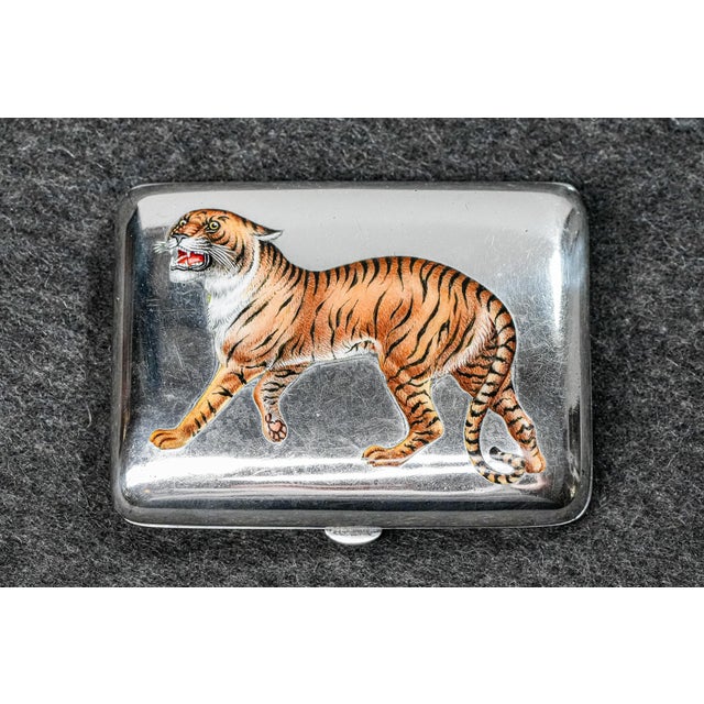 A striking example of early 20th-century luxury tobacciana, this circa 1910 sterling silver cigarette case features a...
