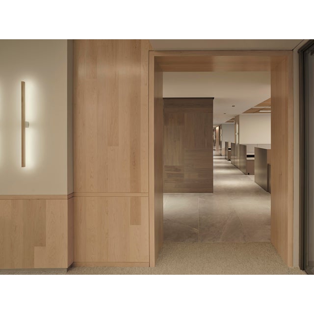 This maple wood sconce is a part of Stick Bulbs' Ray collection. This fixture's light can be hung horizontally or...