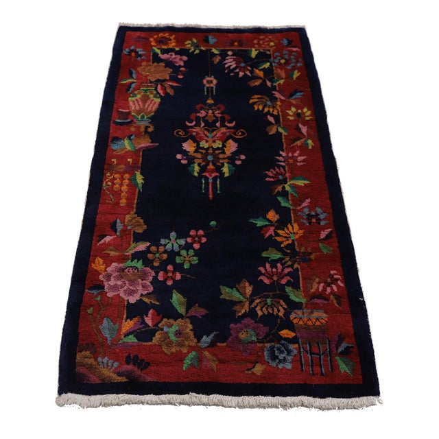 This captivating Vintage Chinese Art Deco Rug showcases the elegance of the 1920s with its deep navy background and...