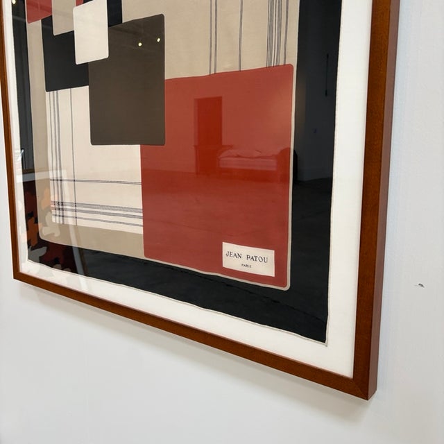 Original vintage mid century Jean Patou scarf in black and rust red geometric motif. Mounted and custom framed in a brown...
