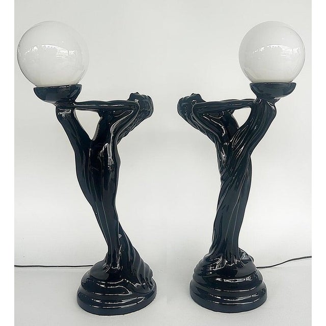 Offered for sale is a large pair of Art Deco style ceramic table lamps with glass shades. Each lamp has a line switch...