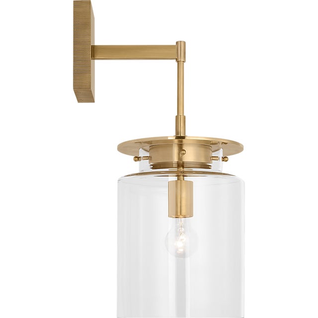 Elias 23" Sconce in Antique-Burnished Brass with Clear Glass Designer: Ray Booth Finish: Antique-Burnished Brass Height:...