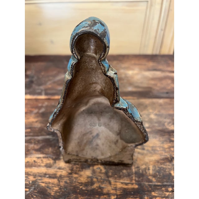 This is an antique Hubley cast iron doorstop. It depicts a "school girl". It was produced in the 1920s. It is so adorable.