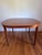 High quality Danish Modern Teak extendable dining table with solid organic turned legs Moreddi. Table is square with...