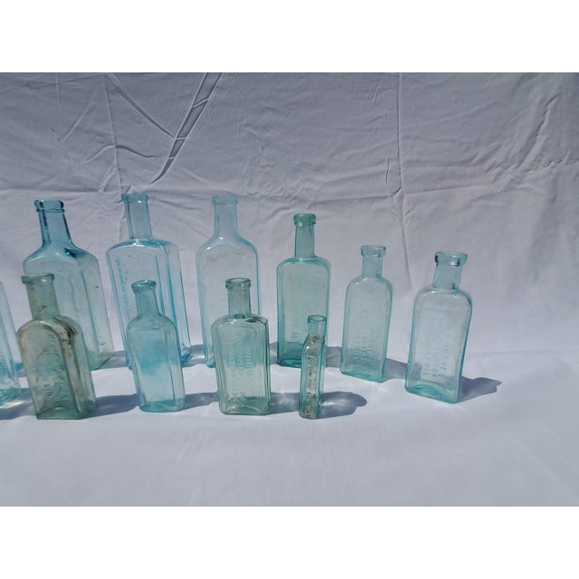 Farmhouse Set of 13 Late 19th Century Embossed Druggist/Pharmacy Bottles For Sale - Image 3 of 6