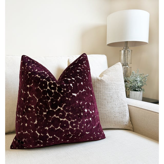 Rich and dimensional, the aubergine leopard pillow features a cut velvet design in deep plum tones over a soft neutral...