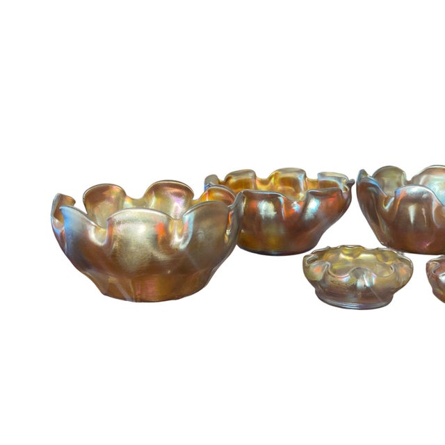 Exceptional antique set of eight Louis Comfort Tiffany Favrile glass salt dishes dating to the early 20th century. This...