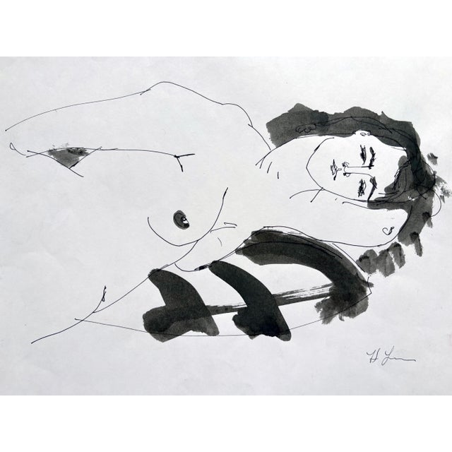An elegant contour line and watercolor portrait of a reclining woman. Delicate, continuous lines define the figure with a...