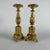 Pair of Carved and Gilded Wooden Candlesticks, 1800s. These two Italian circular candlesticks feature a fluted base...