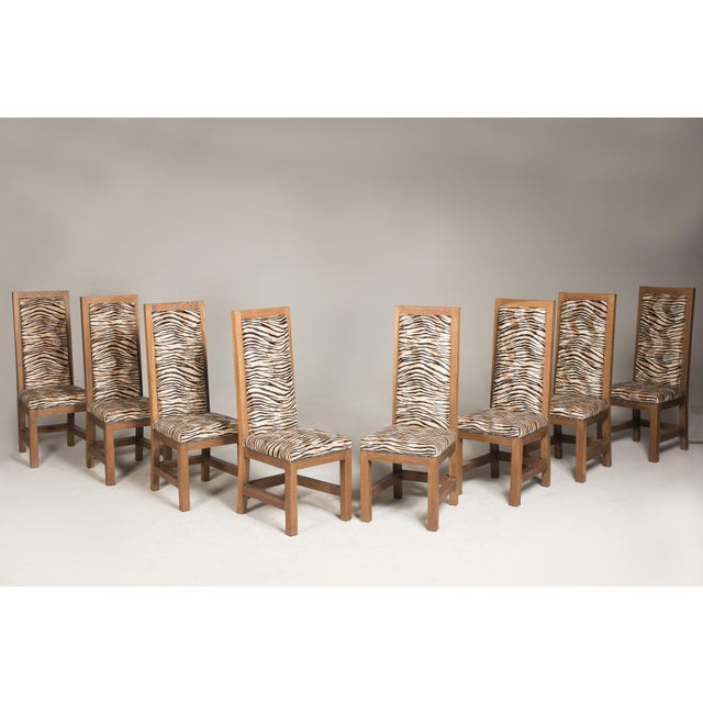 Set of eight Art Deco oak chairs with original patina, wax finish, from France. Recent tiger upholstery.