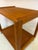 An elegant masterpiece of Danish minimalism: This No. 708 serving trolley, crafted from solid teak, was designed by Aksel...