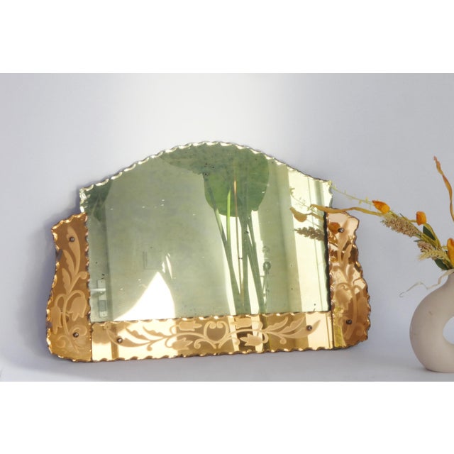 Antique Venetian ornate mirror with a pink frame with floral engraved details. The wall mirror has a nice Art Deco shape....