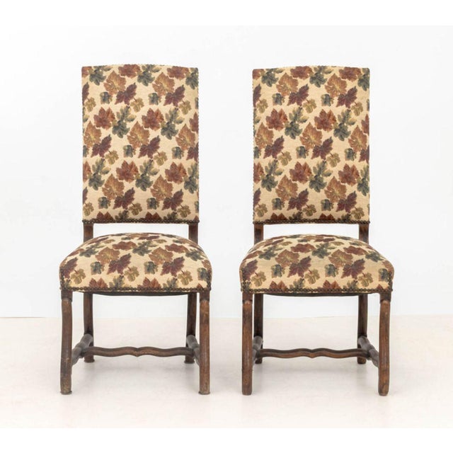Pair of Renaissance Style Autumn leaf Motif Upholstered Side Chairs, with riveted brass details. 42.5" H x 20" W x 19" D;...