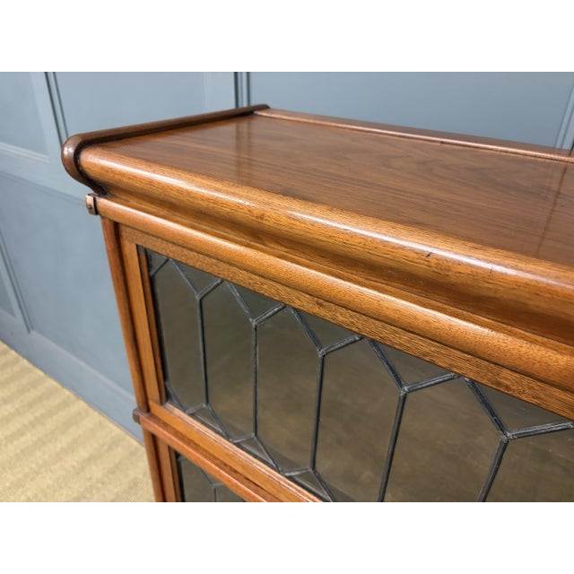A very good example of a Globe Wernicke stacking bookcase in walnut. with 3 glazed sections, all fitted with their...