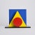 Composed of elementary geometric shapes—circle, triangle, square—this lacquered wood sculpture illustrates Robert-Jean...