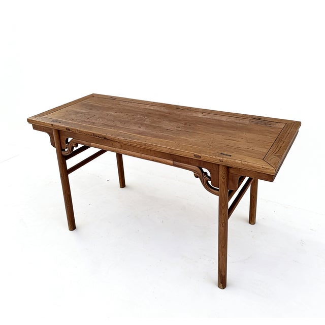 This early 18th century elegant painting table, or pingtou'an, is crafted from solid elm wood, assembled using traditional...