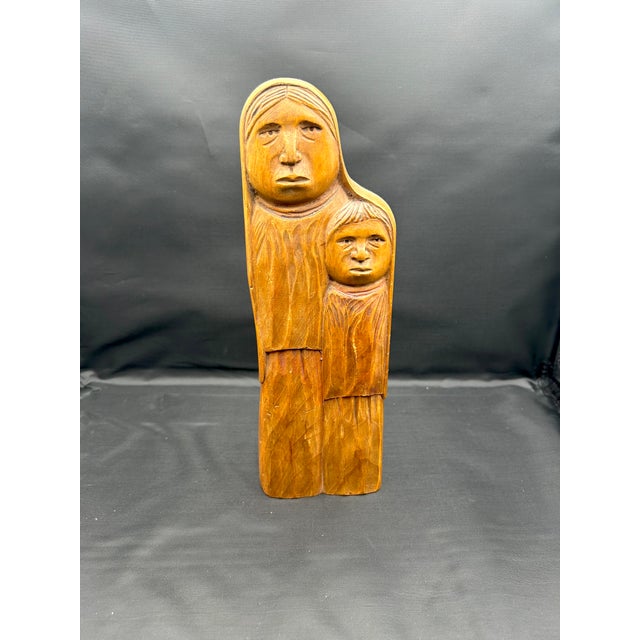 This striking 11" x 3 3/4" x 2 1/4" hand-carved wooden sculpture is an exceptional example of mexican modernist Flores...