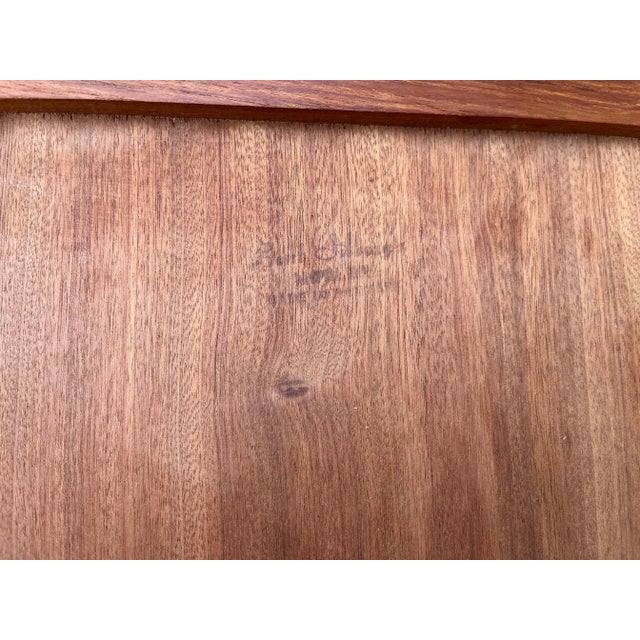 A set of two teak nesting side tables made by Bent Silberg Mobler. Danish Modern in design, these teak nesting tables...