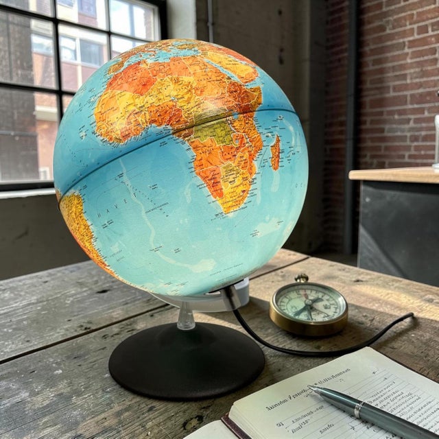 Illuminated globe produced by tecnodidattica s.p.a., italy. the model “tecno globus” combines classic world cartography...