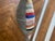 Decorative striped rug pillow with solid colored back. Zipper on back. Down insert included.