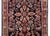 A beautiful early 20th century Persian Sarouk rug with a mirrored floral pattern with myriad floral clusters on the field,...