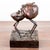 A striking limited edition bronze sculpture titled “Eat or Be Eaten” from the Business Bronze Series by South African...
