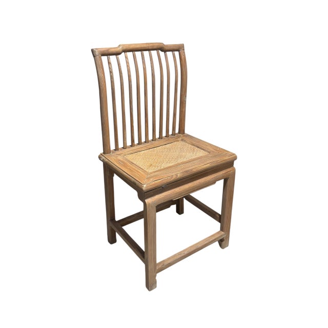 Elegant antique Chinese accent chair in natural elm wood, showcasing traditional craftsmanship with hand-carved back...