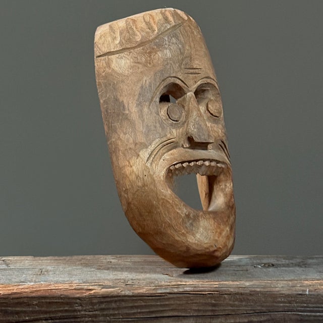 Hand Carved Grotesque Folk Art Mask, Mid-20th Century Handcrafted from a single piece of wood, the mask features an...
