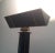 This very elegant floor lamp is made of black lacquered metal and brass. This is an halogen floor lamp. This is French...