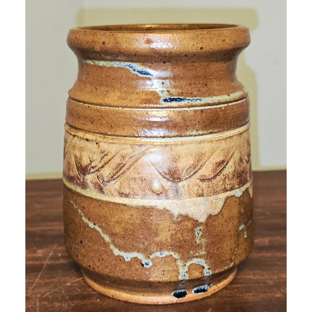 A beautifully crafted 1987 studio pottery vessel signed by Bill Heyduck, showcasing the warm, earthy aesthetic of...