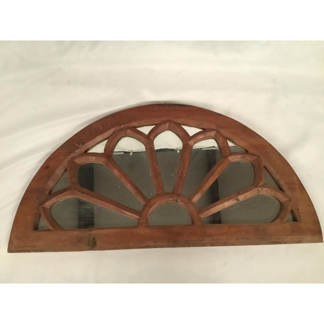Beautiful solid wood accent mirror, 7 detailed sections that are symmetrically fanned out around a central arch. Wonderful...