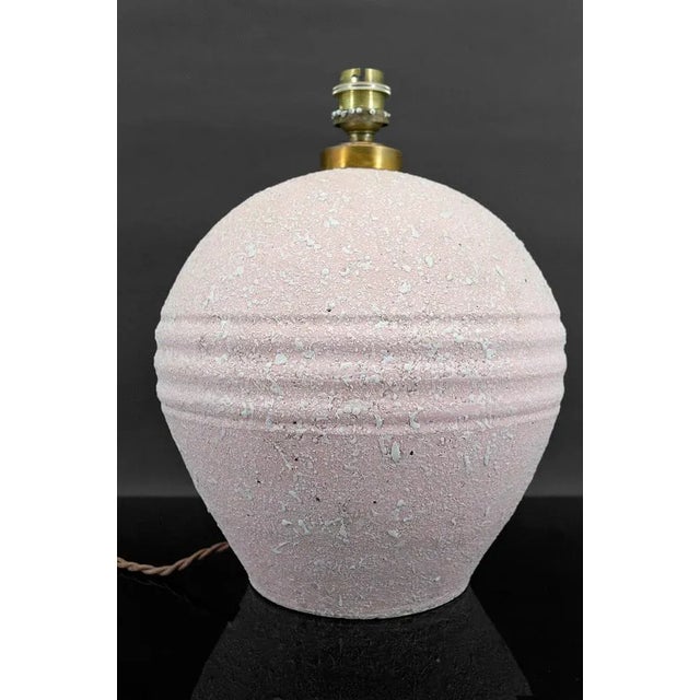 Ceramic lamp with white crisp enamel on a pink background. In the style of Jean Besnard Art Deco, France, Circa 1925. In...