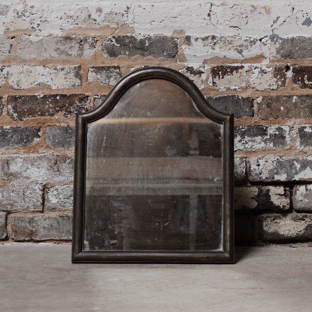 19th-century French vanity mirror featuring a metal frame with elegant detailing and aged patina. Both functional and...