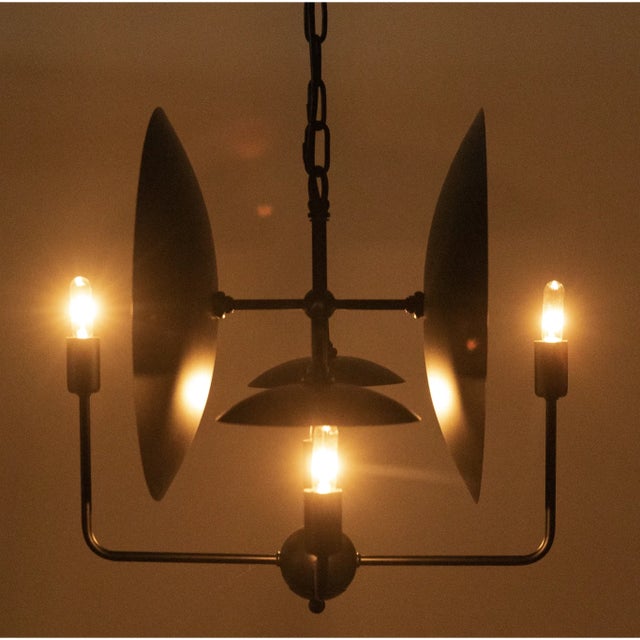This elegant metal ceiling lamp has been expertly artisan crafted and finished in matte black. This lamp is a dazzling...