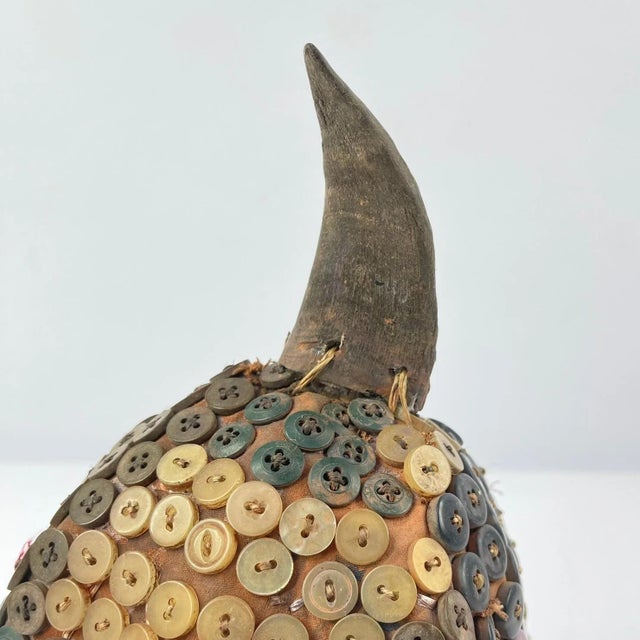 The Lega Bwami Society hat was crafted in the eastern regions of the Democratic Republic of Congo. This woven, palm fiber...