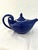 Charming Hall ceramic "Aladdin" genie design lidded teapot in a shade of Cobalt blue with white interior. Holds 48 ounces.