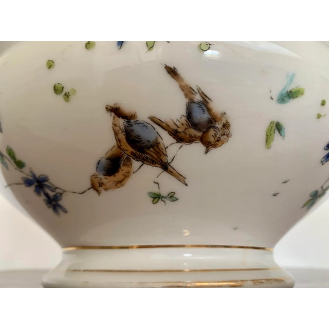 Incredible, late 19th century, European soup tureen in white, gilded porcelain with hand painted decorations of birds and...